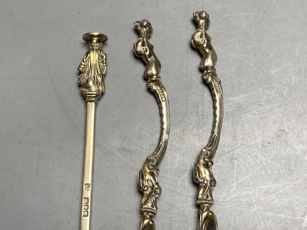 An Edwardian silver seal top spoon, London, 1905, 19.9cm and a pair of novelty plated spoons with figural handles.